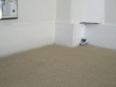 Little Lego car in corner