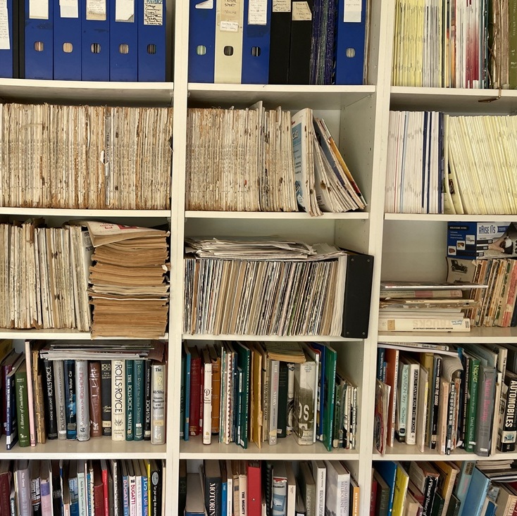 Bookshelf filled with neatly organised magazines and books
